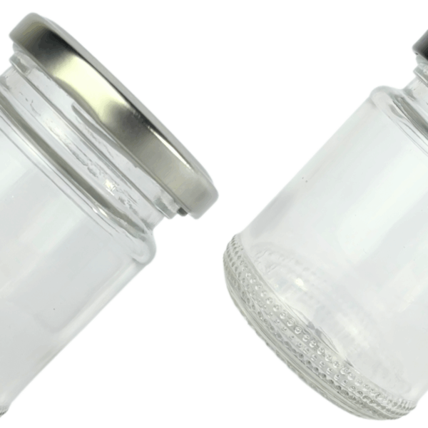 Bollón de vidrio 150ml con tapa metálica negra o plateada, ideal para cremas, velas artesanales, cosmética natural o productos a granel. Envase de vidrio resistente, presentación elegante.